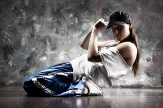 Woman sitting floor arm up - dynamic pose free wallpaper
