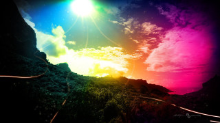 Rainbow colored sky clouds sun - a trail free wallpaper