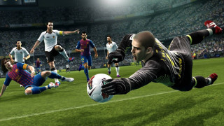 Man diving soccer ball game - a soccer field free wallpaper