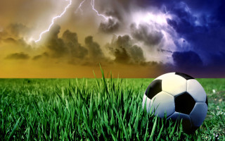 Soccer ball grass storm cloud - thunderstorm free wallpaper