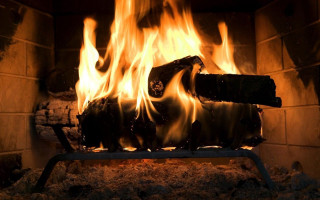 Fireplace burning metal frame logs - a fireplace free wallpaper