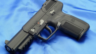 Gun blue cloth black frame - a blue cloth free wallpaper