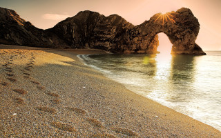Beach rocks footprints sand water - the sand and water free wallpaper