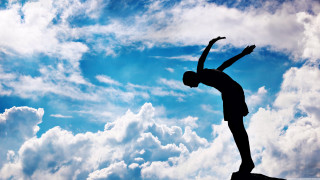 Person standing rock arms in - dynamic pose free wallpaper