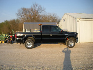 Black truck building tractor man - eric dinyer free wallpaper