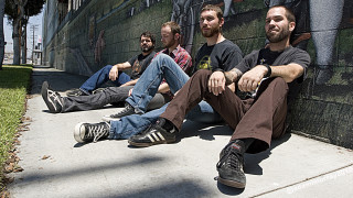 Men sitting building graffiti wall - post grunge free wallpaper