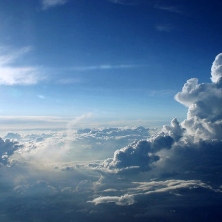 Sky clouds sunlight cityscape ocean - free sky wallpaper for tablet