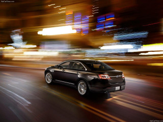 Car night street blurry lights - the background and a street light in the foreground free wallpaper