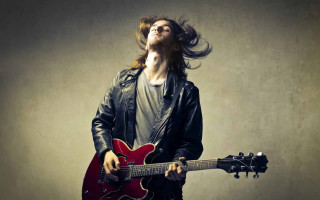 Long haired man playing red - long hair playing free wallpaper