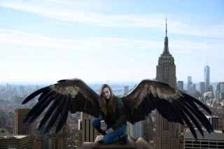 Woman wings sitting ledge city - christabel dennison free wallpaper