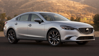 Silver car parked road mountain - a mountain range in the distance free wallpaper