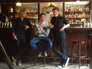 Three men sitting bar drinks - photoshoot free wallpaper