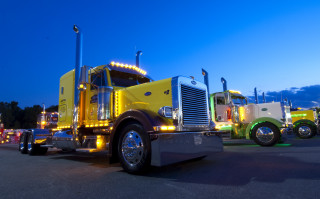 Yellow semi truck parking lot - a parking lot free wallpaper