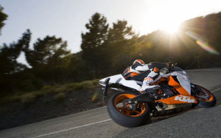 Motorcycle ride road trees bushes 2 - the sun shining behind them free wallpaper