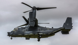 Military helicopter flying cloudy sky - wing and a propeller free wallpaper