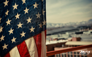 American flag balcony city background - a large american flag free wallpaper