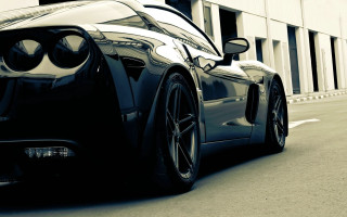 Black sports car parked road 2 - a large window free wallpaper