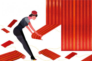 Woman wrapping red rug yarn - a red rug free wallpaper