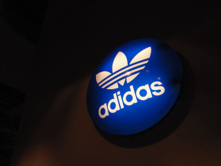 Blue adidas sign building night - light effect free wallpaper