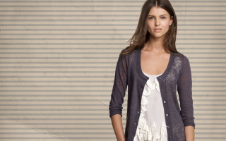 Woman suitcase jacket wall standing - a suitcase free wallpaper