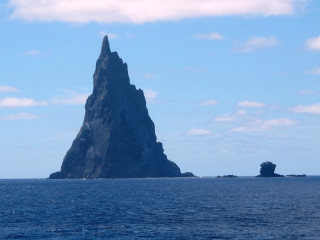 Large rock formation ocean boat 2 - the water below free wallpaper