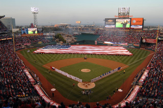 Baseball stadium american flag crowd - a large american flag free wallpaper