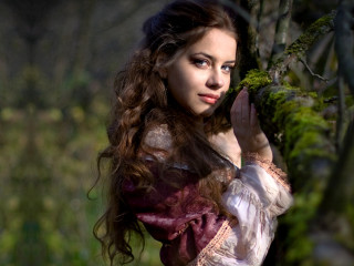 Woman dress holding tree branch 2 - a tree branch in a forest free wallpaper