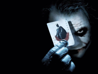 Man holding joker card knife - charles codman free wallpaper