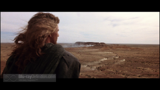 Woman looking out barren landscape - barren free wallpaper