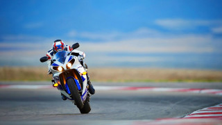 Motorcycle race track sky grass - motion blur free wallpaper