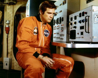 Man orange space suit control - retrofuturism free wallpaper