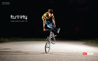 Man riding bike air night - kitsch movement free wallpaper