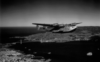 Airplane flying water mountains bridge - alson s. clark free wallpaper