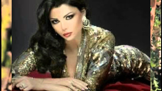 Woman longhair golddress redcouch blackbackground - a red couch free wallpaper