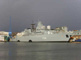 Large ship docked harbor buildings - building free wallpaper