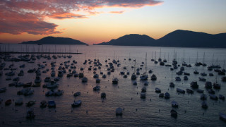 Boats ocean sunset mountain background - a large group free wallpaper for desktop