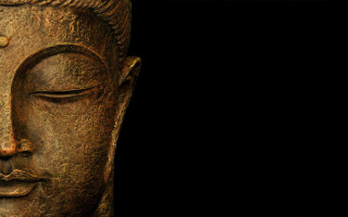 Buddha statue closeup black background 3 - a black background behind free wallpaper