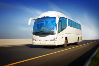 White bus driving road grass - turnaround free wallpaper for desktop