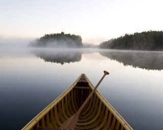 Canoe foggy water reflection forest - a canoe free wallpaper