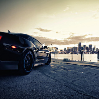 Black sports car water city - free cars wallpaper for tablet