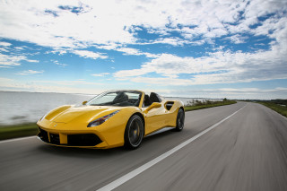Yellow sports car ocean road - a yellow sports car free wallpaper