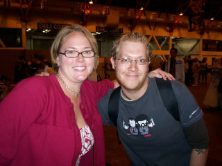 Man woman posing picture building 2 - the background and a sign free wallpaper