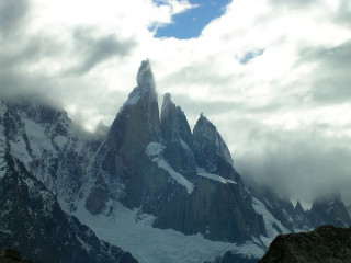 Snowy mountain clouds rocks ground - emiliano ponzi free wallpaper