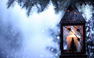 Lit candle tree branch snow - atmospheric free wallpaper