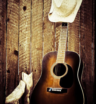 Cowboy hat guitar wooden wall - a stock photo free wallpaper for tablet