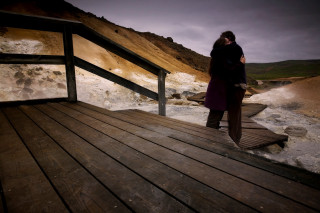 Woman standing wooden deck river - soft focus free wallpaper for desktop