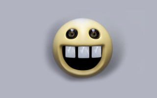 Yellow smiley face four eyes - a yellow smiley face free wallpaper