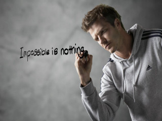 Man holding marker impossible is - nothing free wallpaper