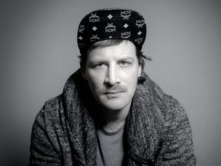 Man hat sitting serious looking - peter konig free wallpaper