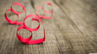 Red paper circles wooden surface 3 - a wooden table free wallpaper